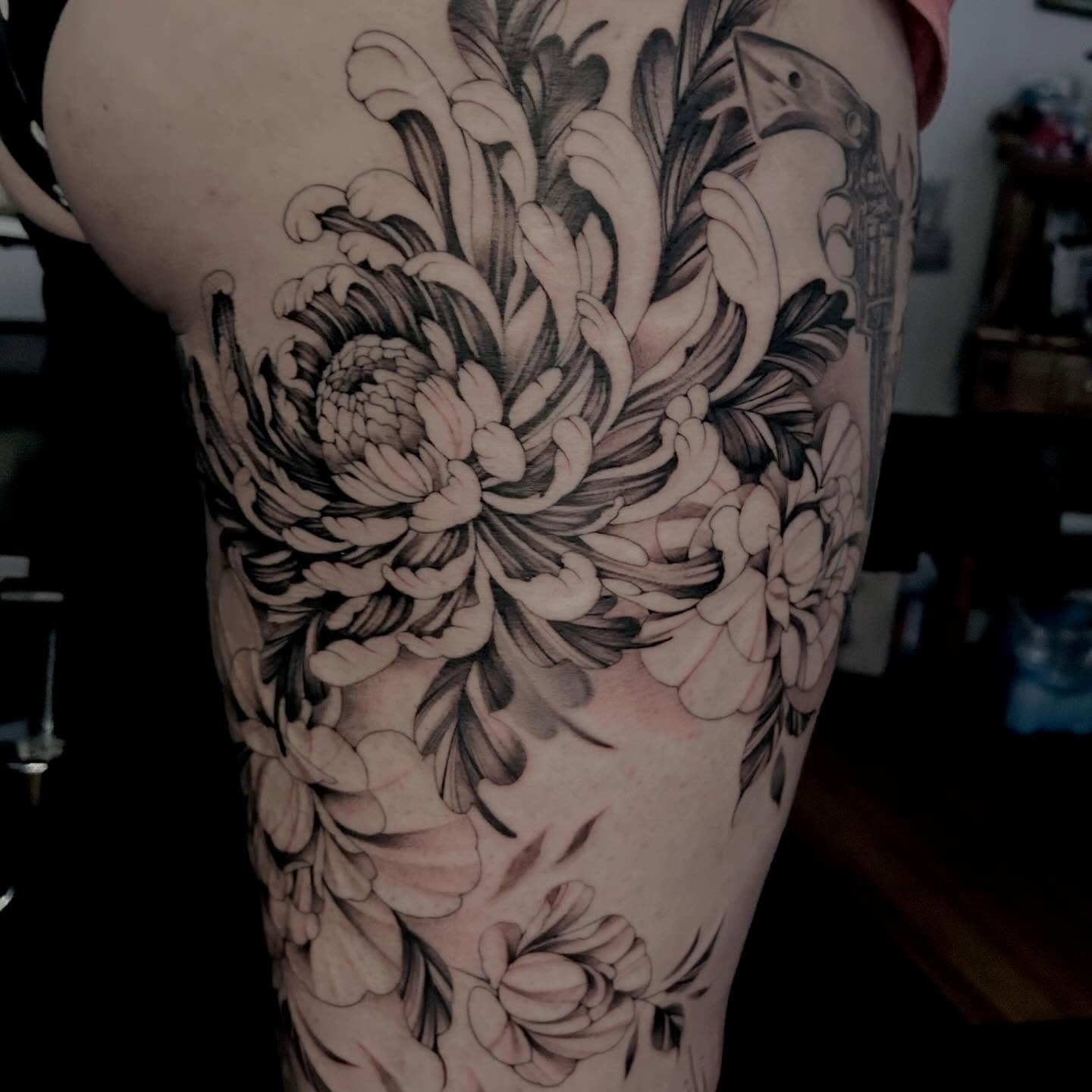 Chrysanthemums black and grey tattoo on the thigh by Jonny Tattoo PHX AZ