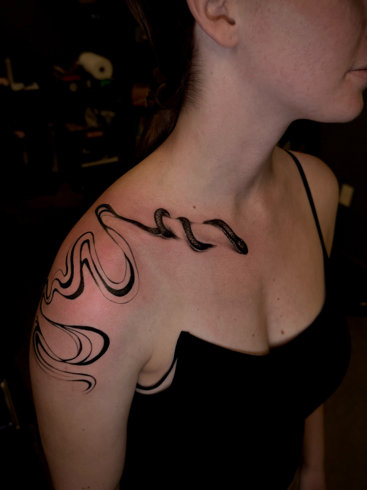 Snake black and grey tattoo on the shoulder by Thomas Martinez