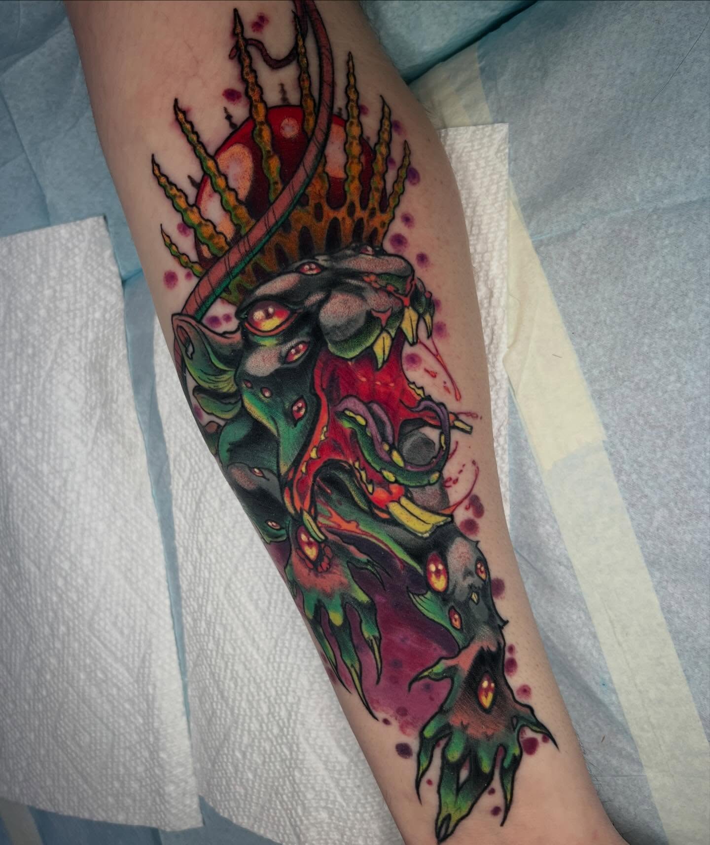 Monster dark realism tattoo on the forearm by Kate Erso