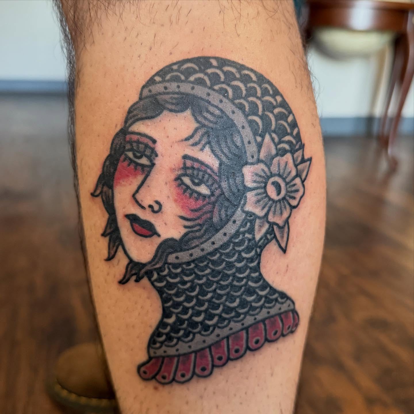 Woman with helmet American traditional tattoo on the forearm by Joe Truck