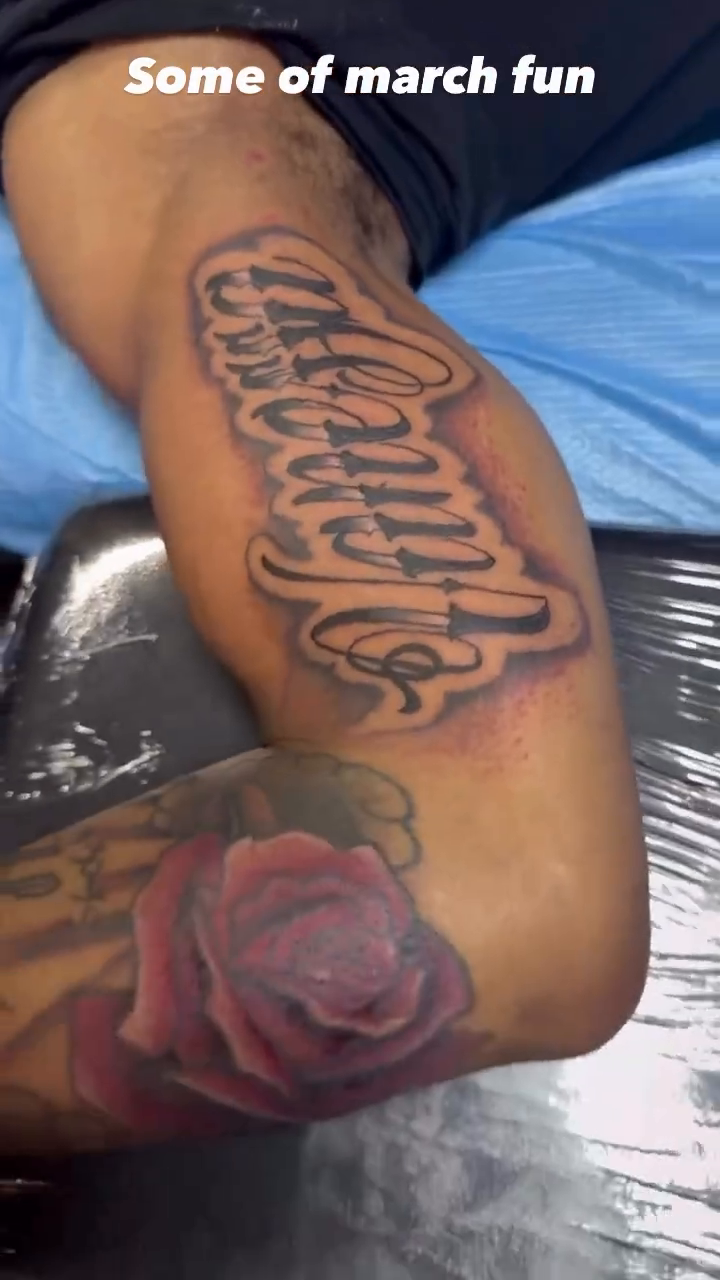 Script tattoo with a rose lettering tattoo on the upper arm by Teddi James, Renton, Washington