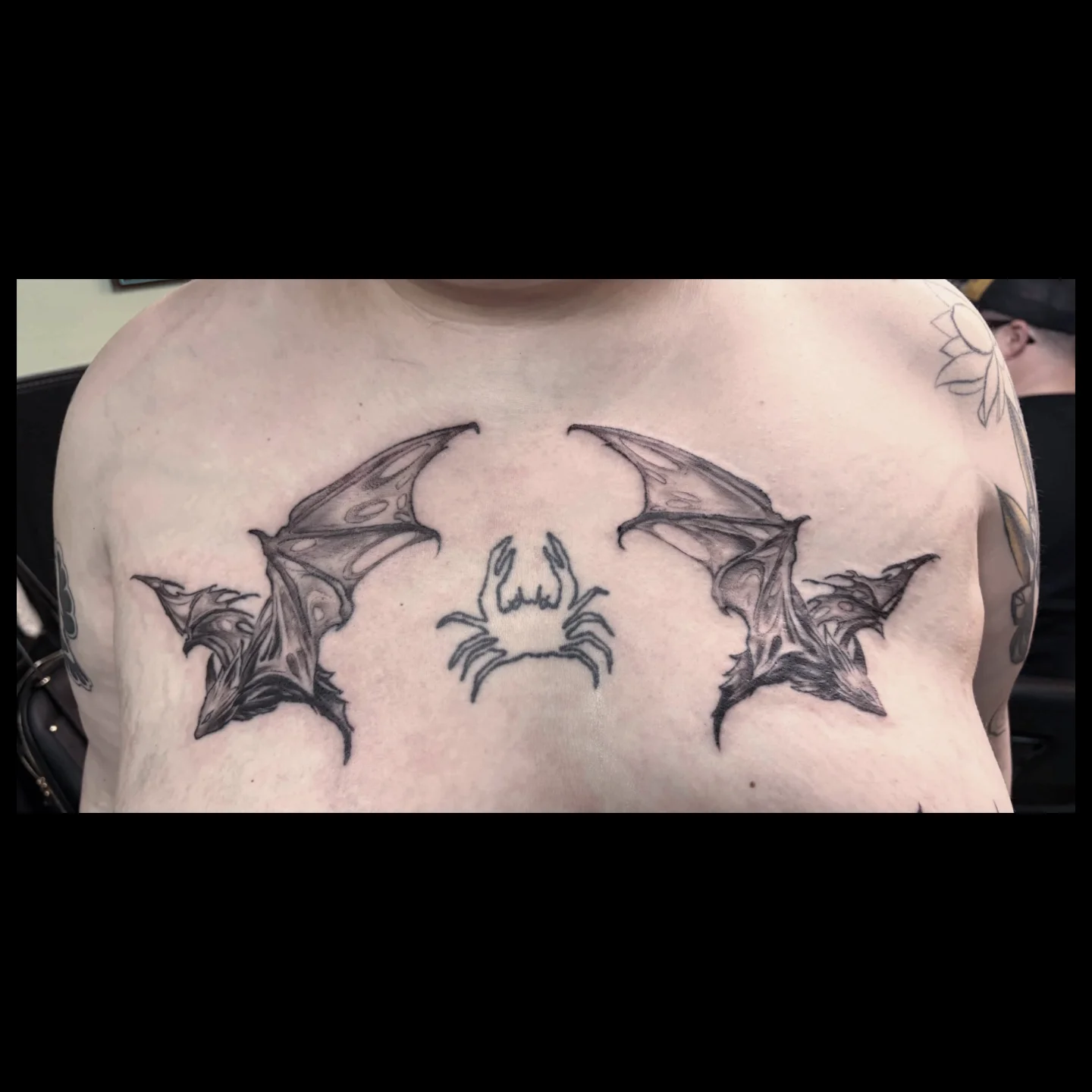 Bat wings and spider black and grey tattoo on the chest by Ashton Allen-Ruiz, Portland, Oregon