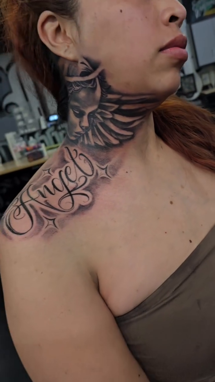 Angel script with a face above Chicano tattoo by Richie Garcia, Hesperia, California