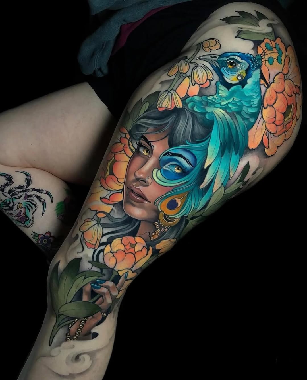 Woman with peacock and flowers neo-traditional tattoo on the forearm by Evin Pfaff, Bedford, Pennsylvania