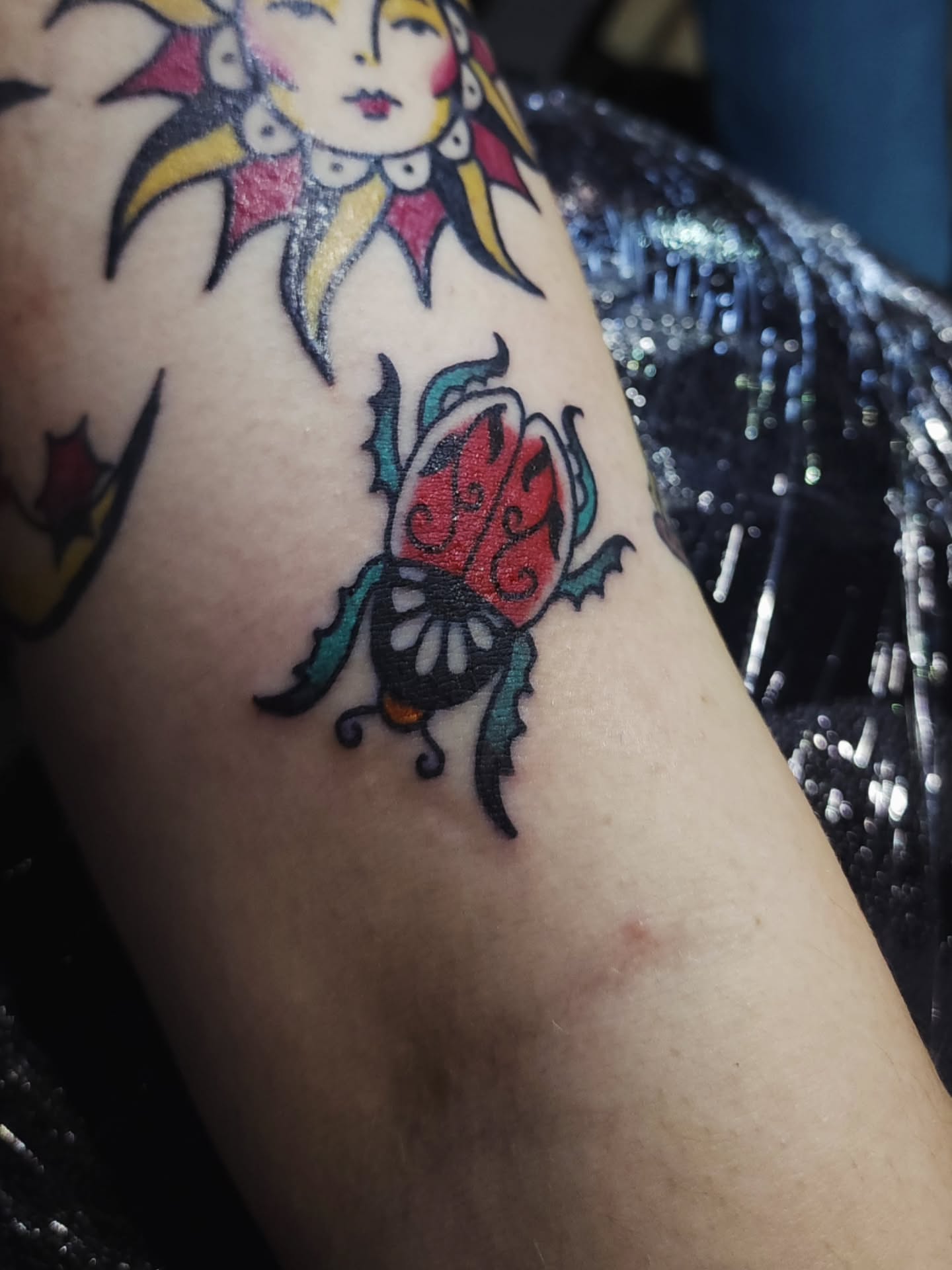 Beetle American traditional tattoo on the forearm by Maxine Stewart