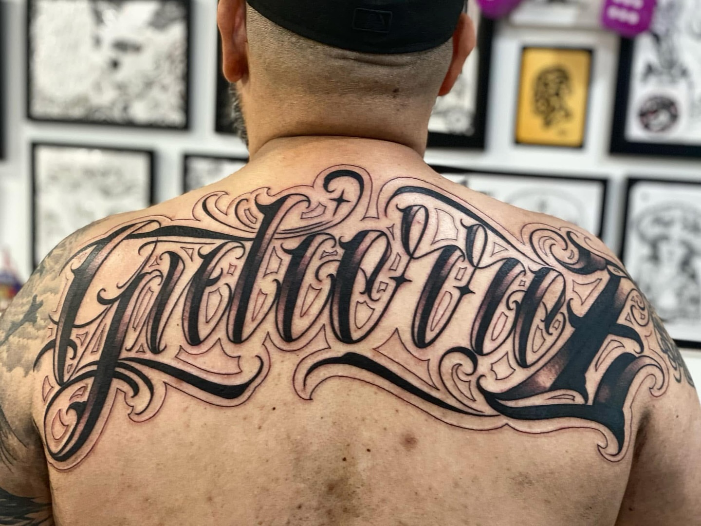 Script lettering lettering script tattoo on the back by Lex Miranda