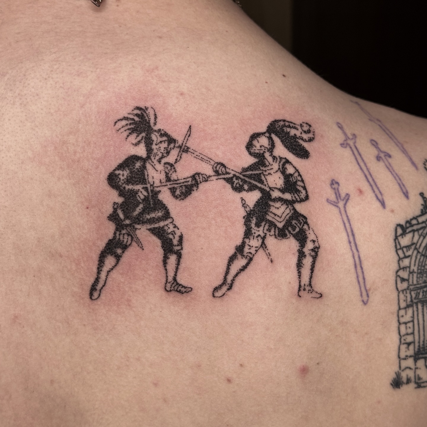 Dueling knights black and grey tattoo on the back by Joint Killer