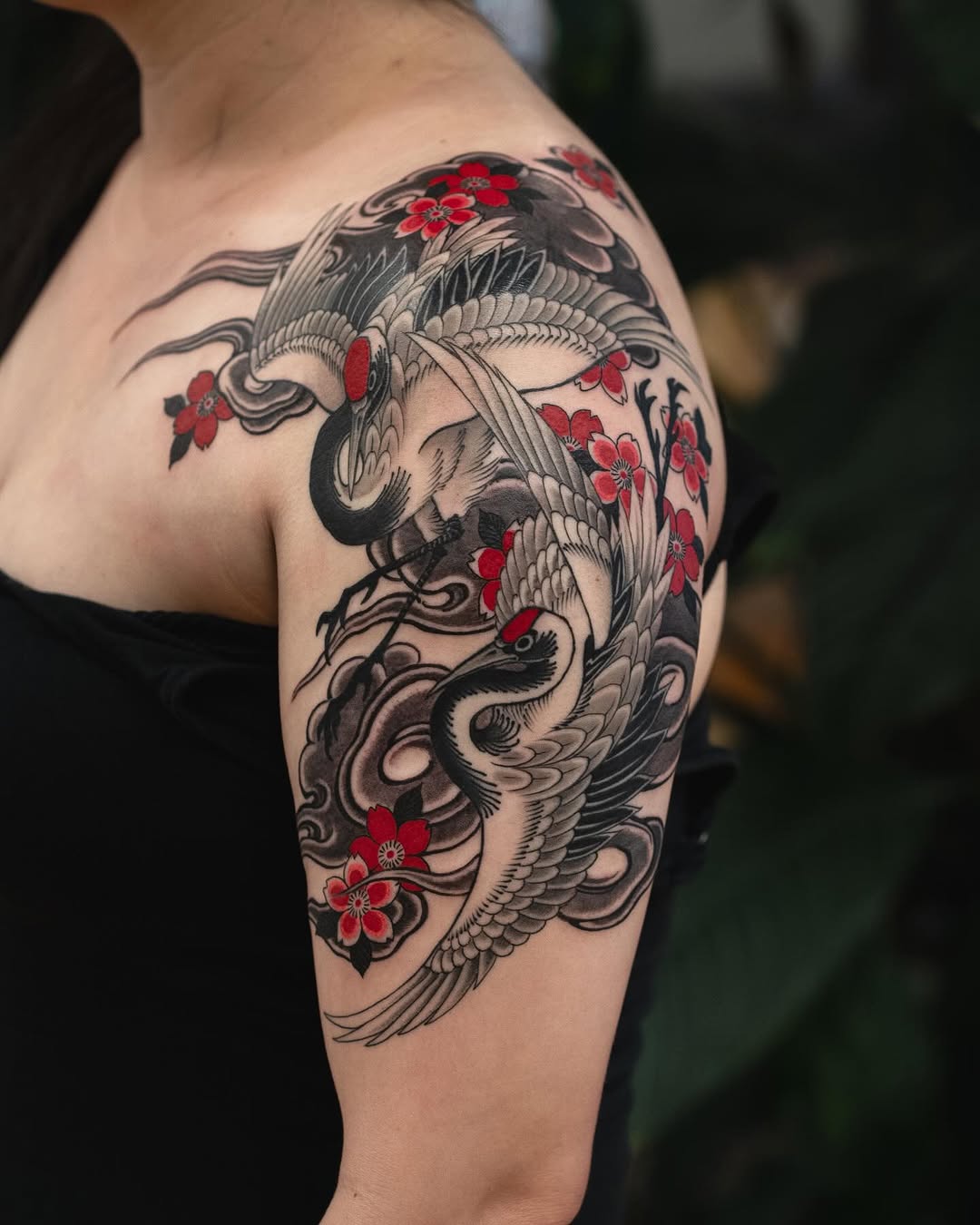 Cranes and cherry blossoms Japanese tattoo on the shoulder by Matt Leibo, San Francisco, California