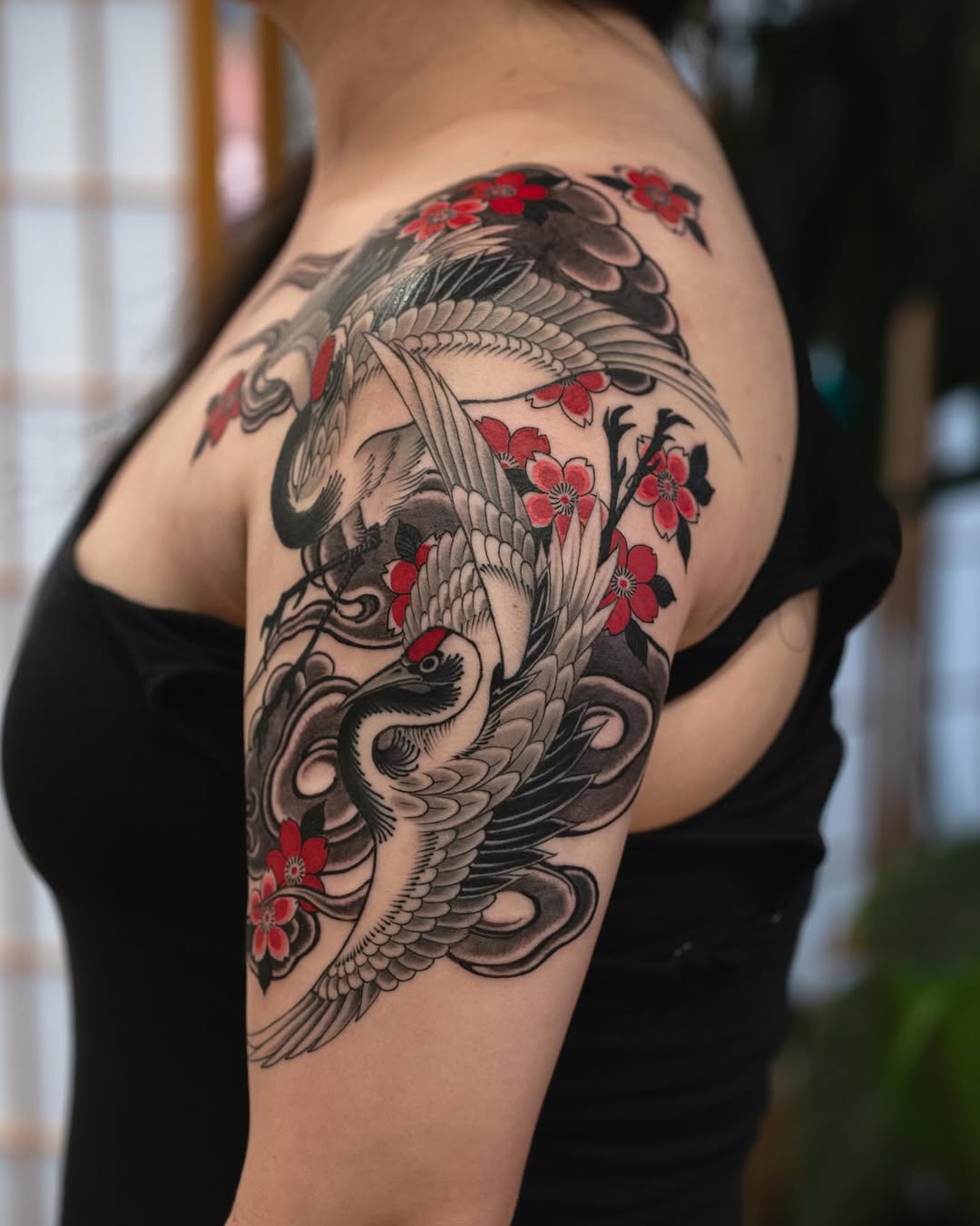 Cranes and cherry blossoms Japanese tattoo on the shoulder by Matt Leibo, San Francisco, California