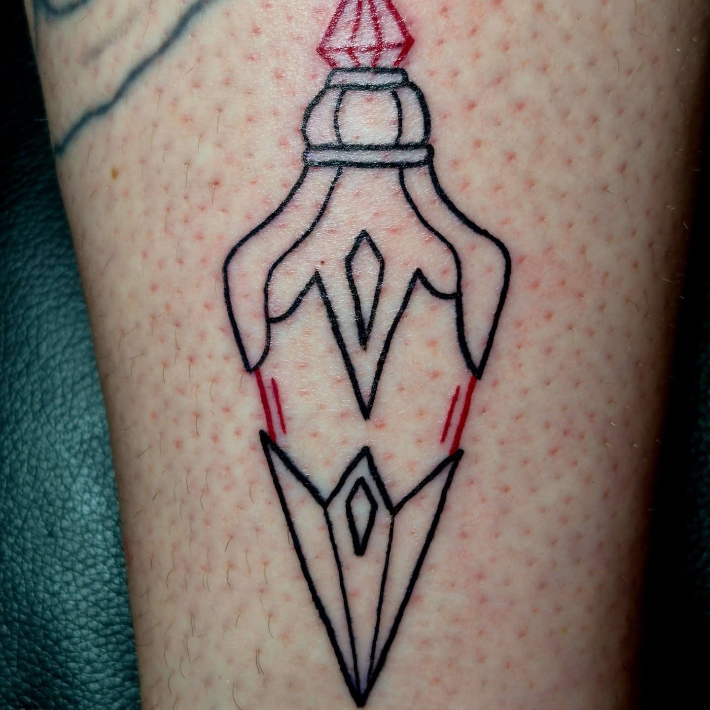 Rocket geometric tattoo on the forearm by Bobby H