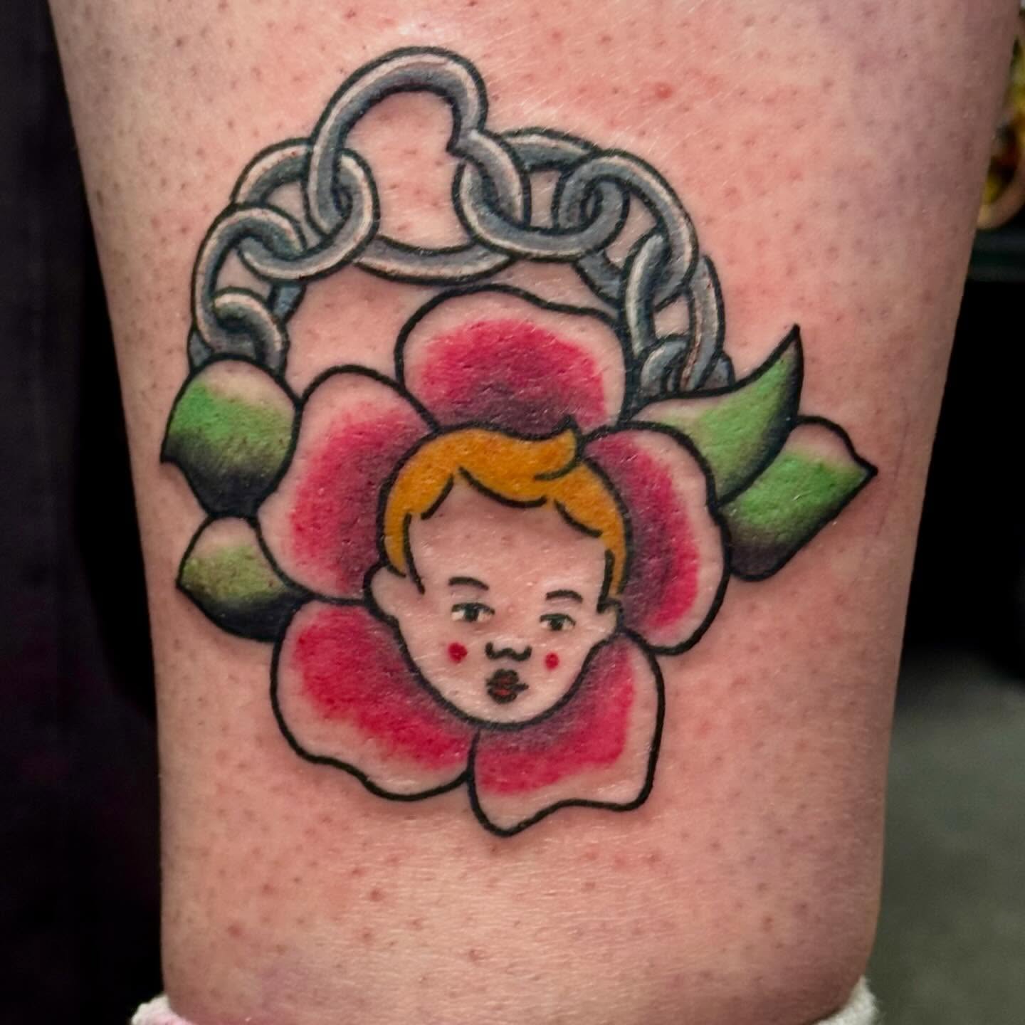 Flower with baby face American traditional tattoo on the forearm by 🌛 𐌀𐌋𐌄𐋄𐌉𐌔 🌜