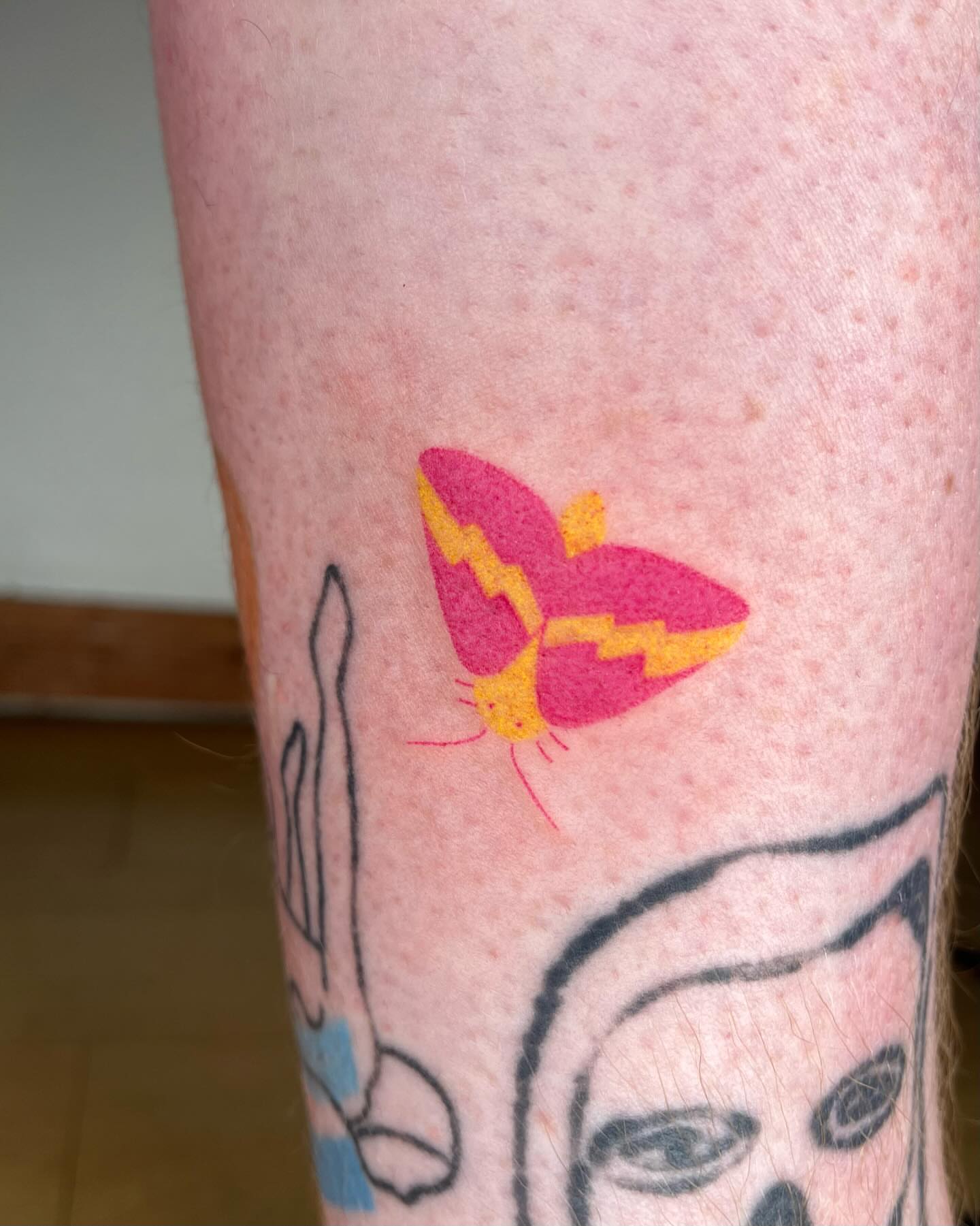 Butterfly minimalist tattoo on the forearm by Jenna