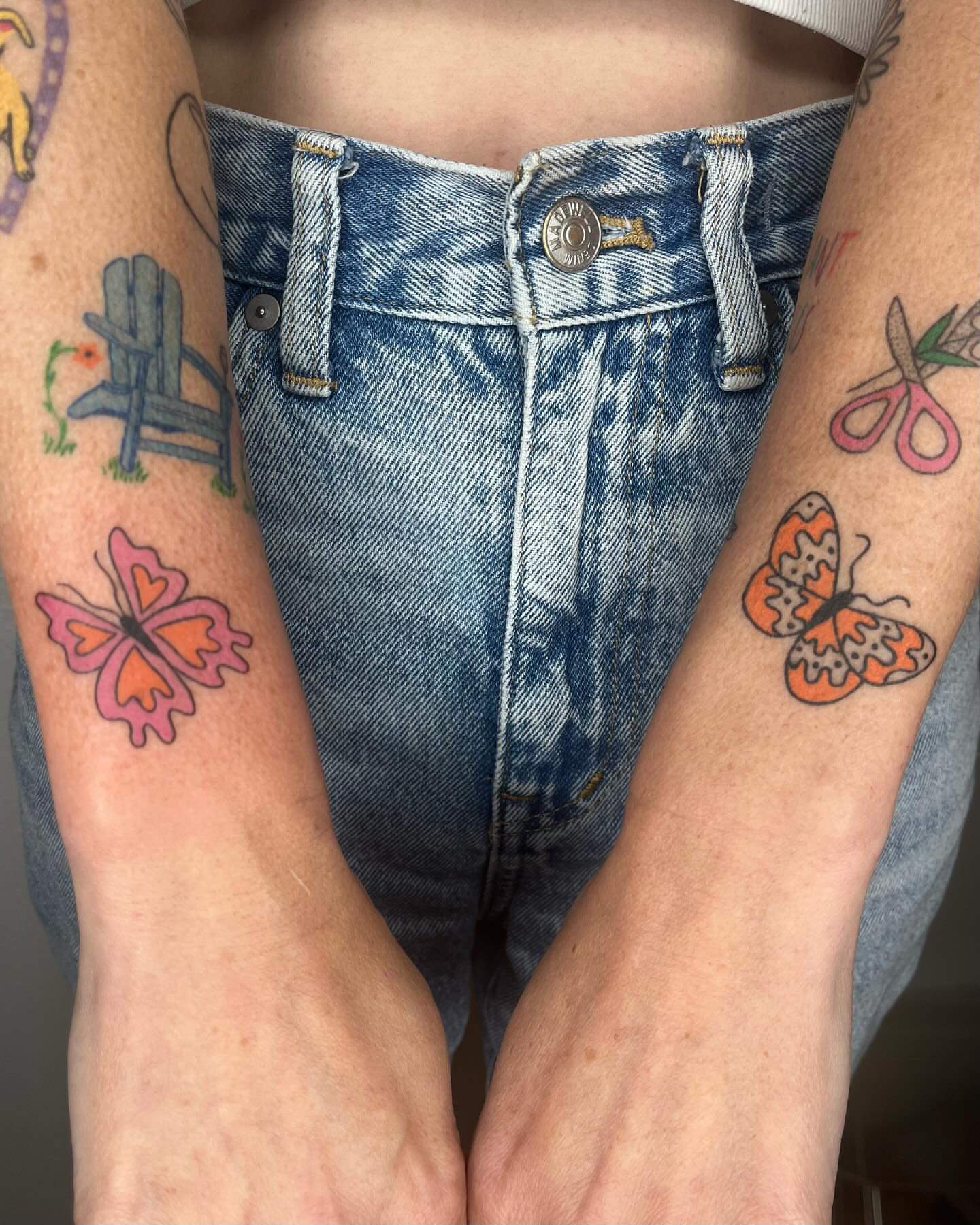 Butterfly new school tattoo on the forearm by Jenna
