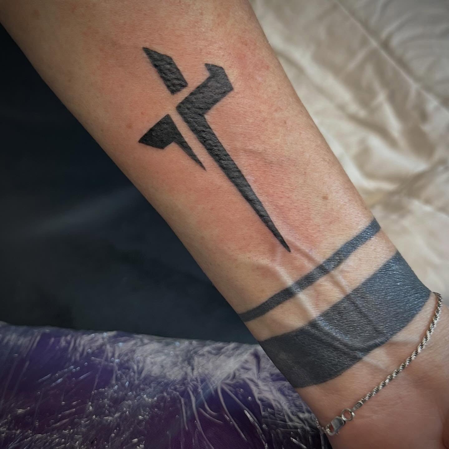 Geometric symbol geometric tattoo on the forearm by Mikaila Jean