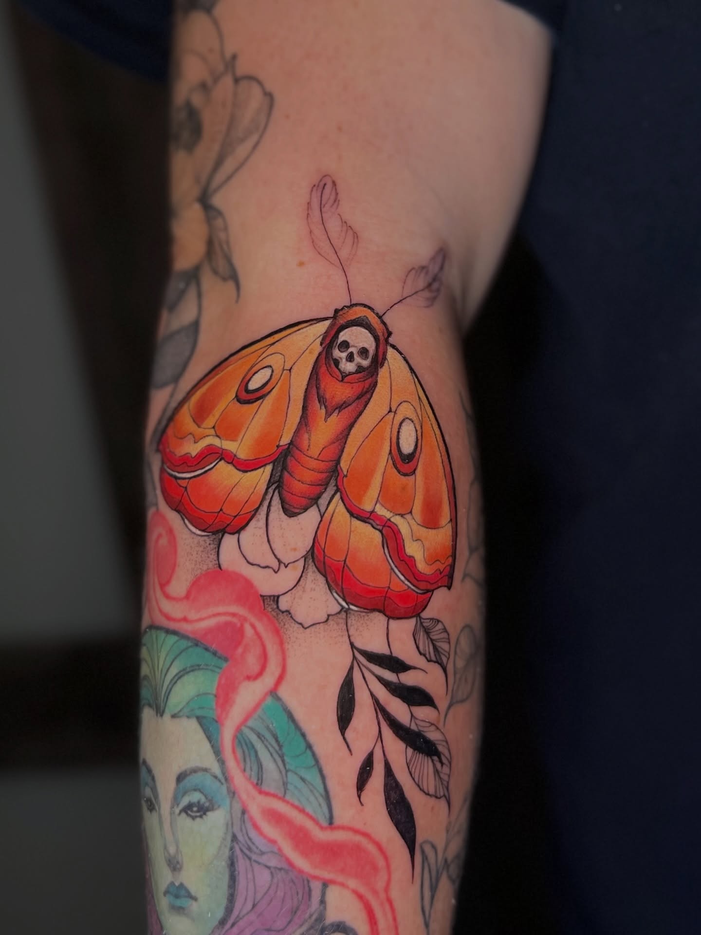 Butterfly with skull new school tattoo on the forearm by Dominick Cali, East Islip, New York