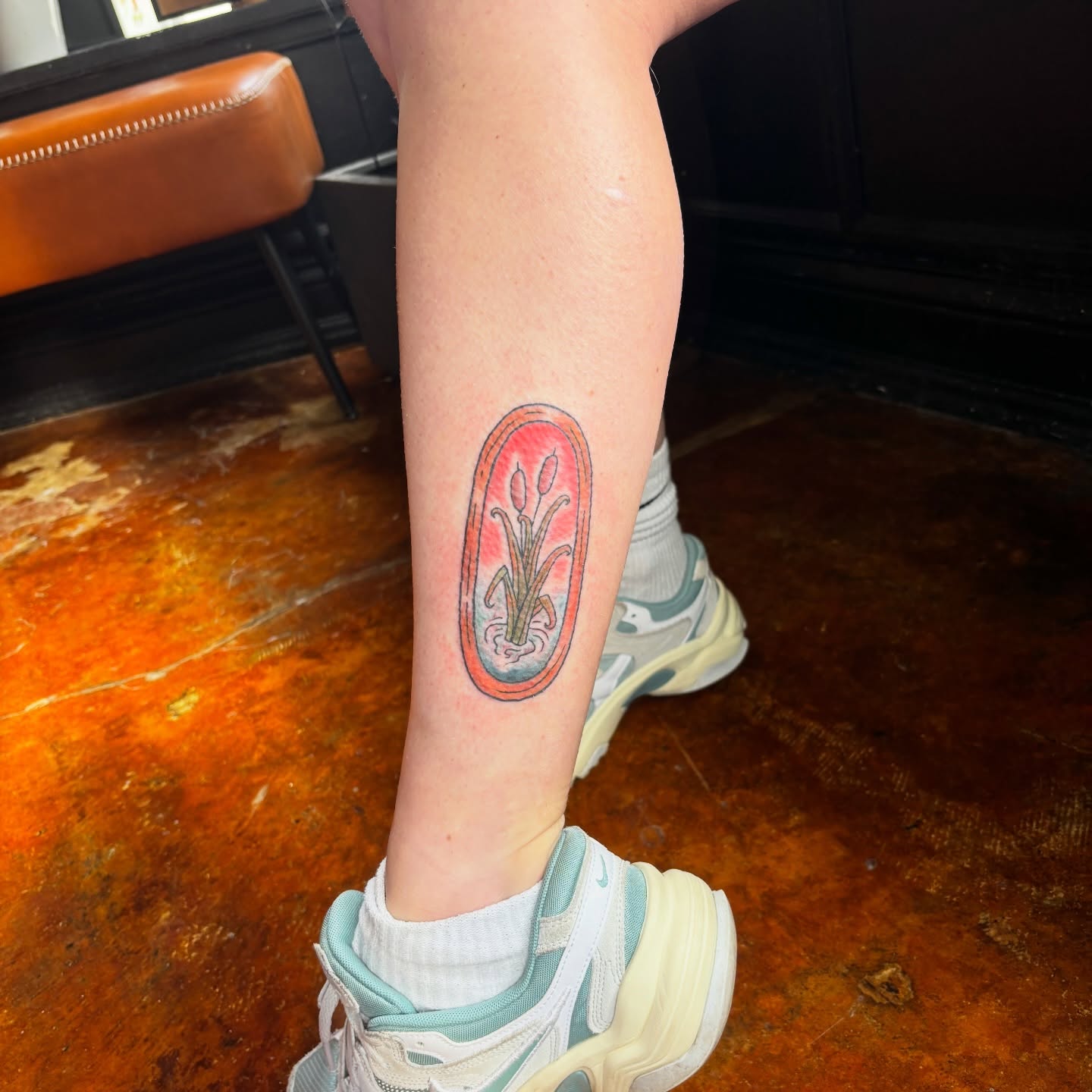 Plant in vase dotwork tattoo on the calf by Lilly Evans