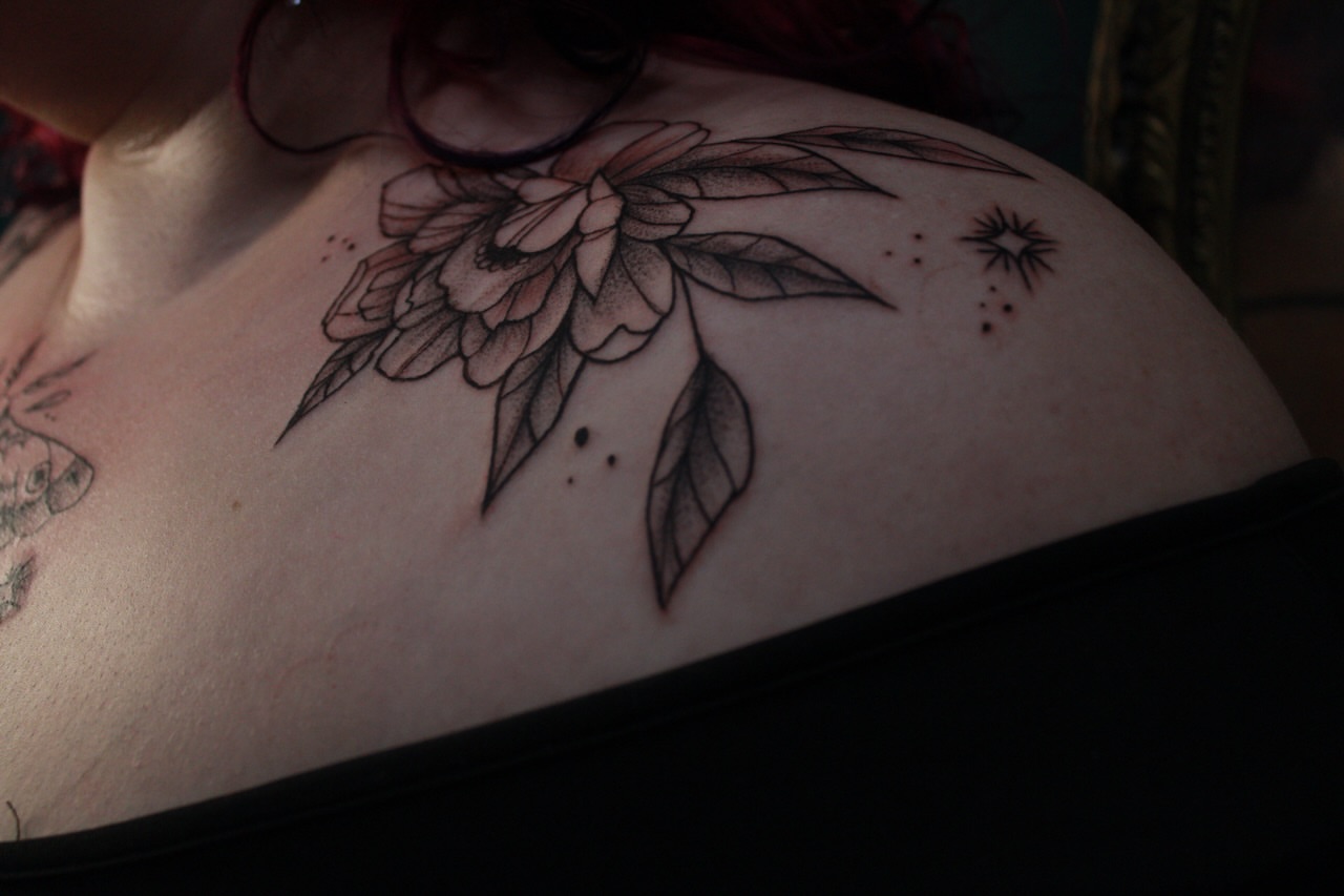 Flower black and grey tattoo on the shoulder by Lexi