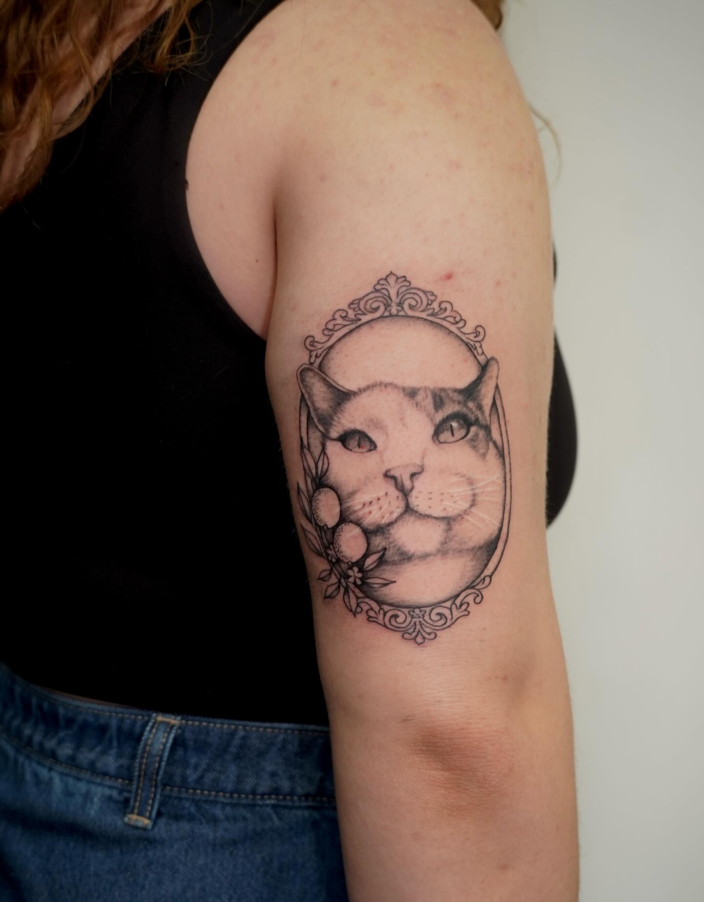 Cat realism tattoo on the upper arm by Presley Tattoos, Murfreesboro, Tennessee