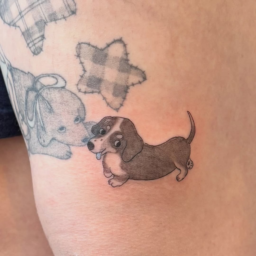 Dachshund dog realism tattoo on the forearm by Kirsten