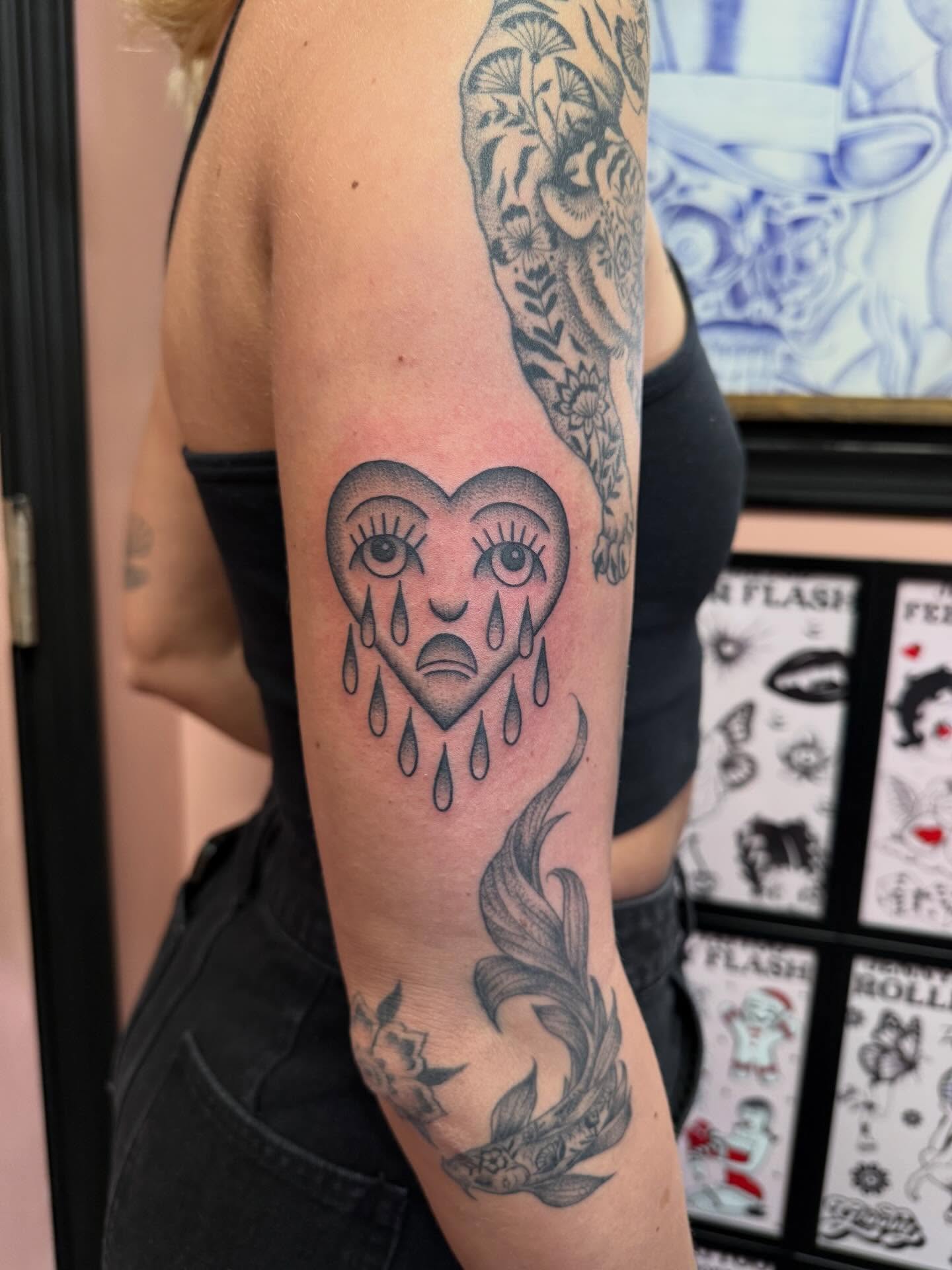 Heart with eyes and tears American traditional tattoo on the forearm by Jennylee Aerts, Asbury Park, New Jersey