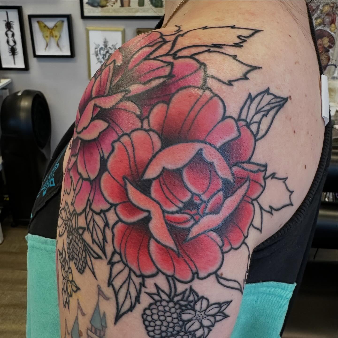 Peony American traditional tattoo on the shoulder by Katie Beth