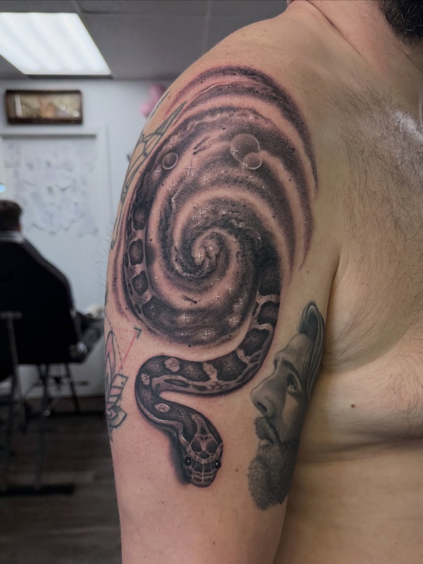 Snake realism tattoo on the shoulder by Meagan Dare