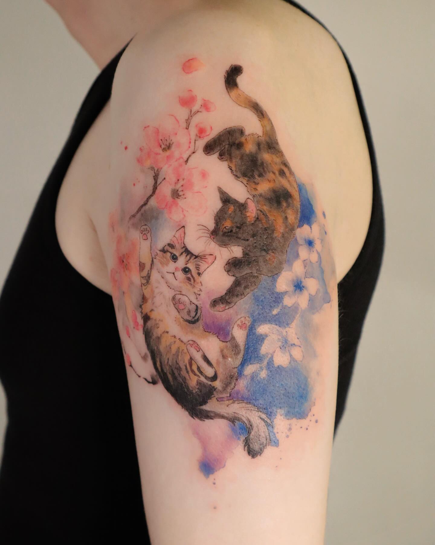 Cats and blossoms watercolor tattoo on the shoulder by Sylvia｜思岐, Vancouver, British Columbia