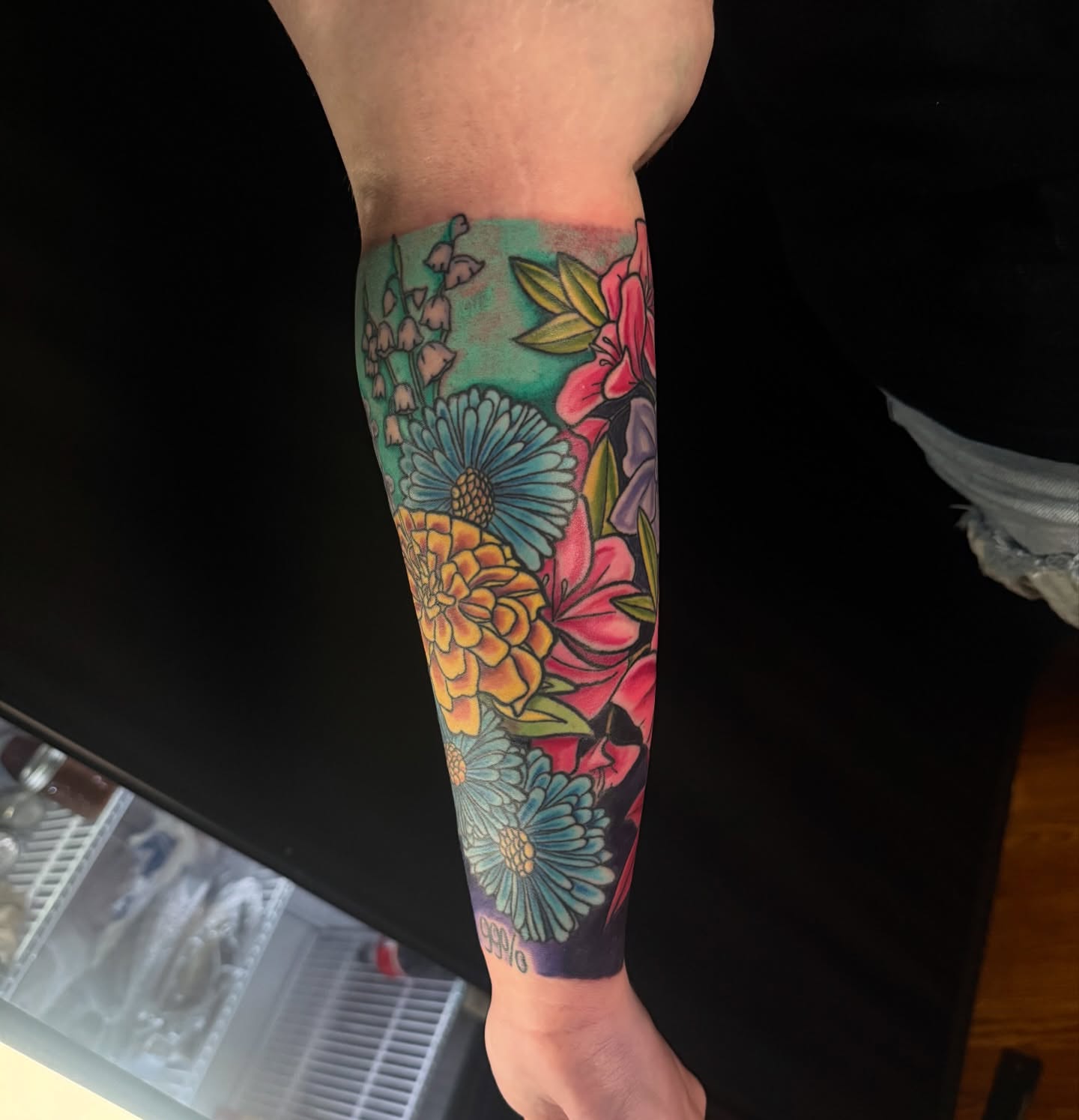 Floral bouquet new school tattoo on the forearm by joshua sides