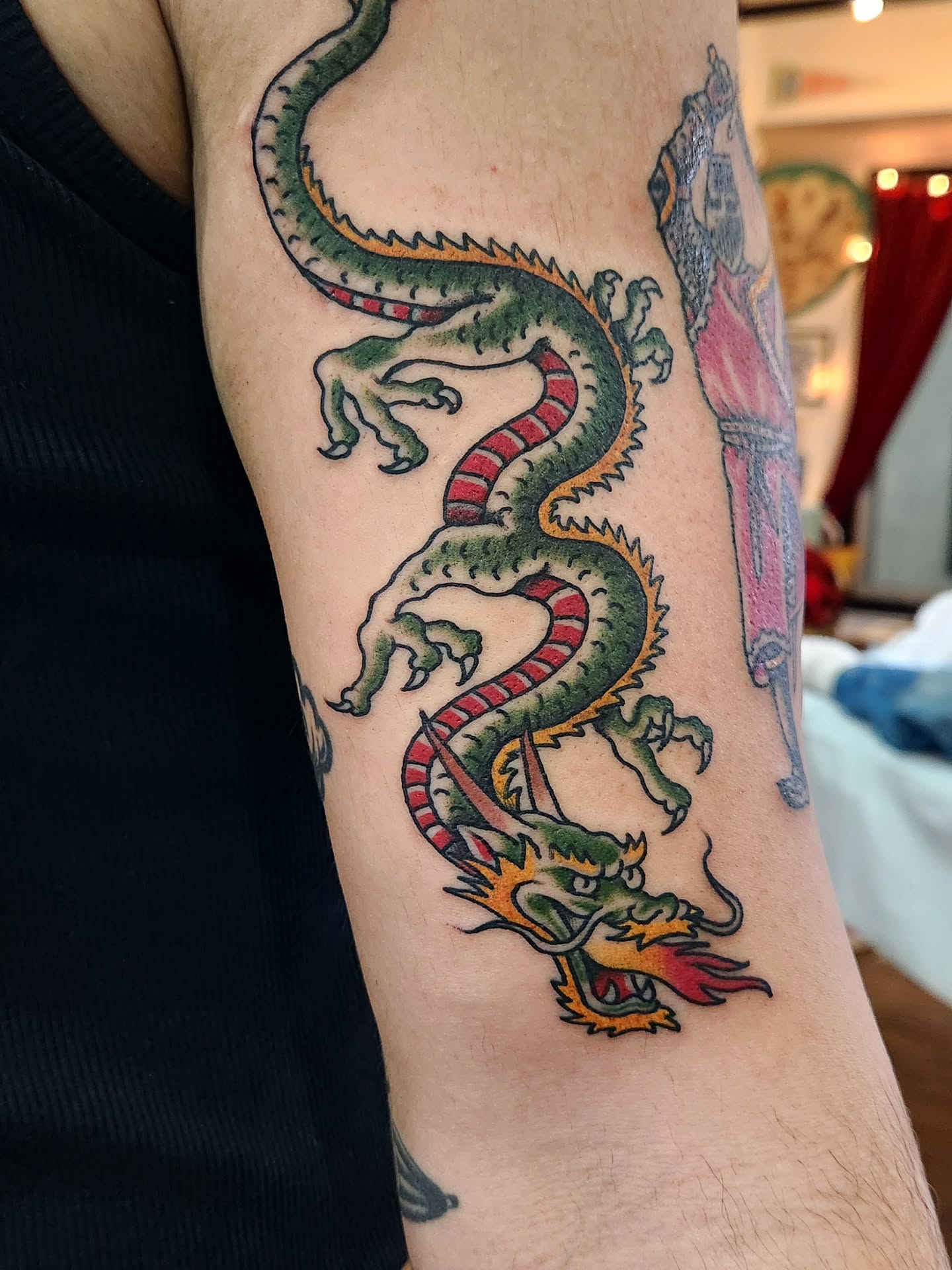Dragon American traditional tattoo on the forearm by Douglas Grady