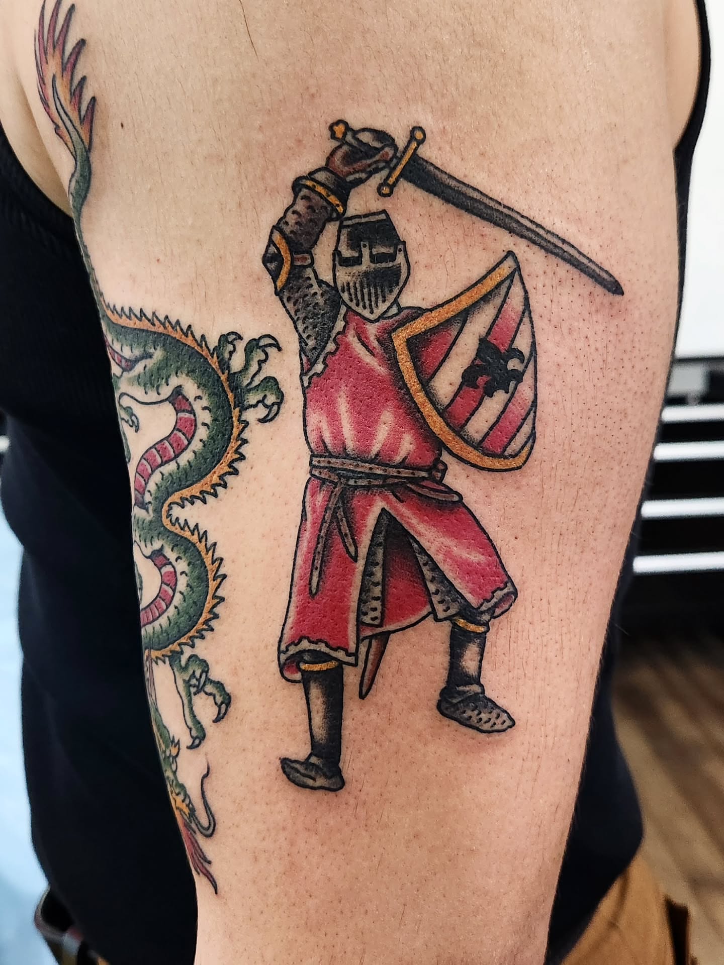 Knight and dragon realism tattoo on the forearm by Douglas Grady