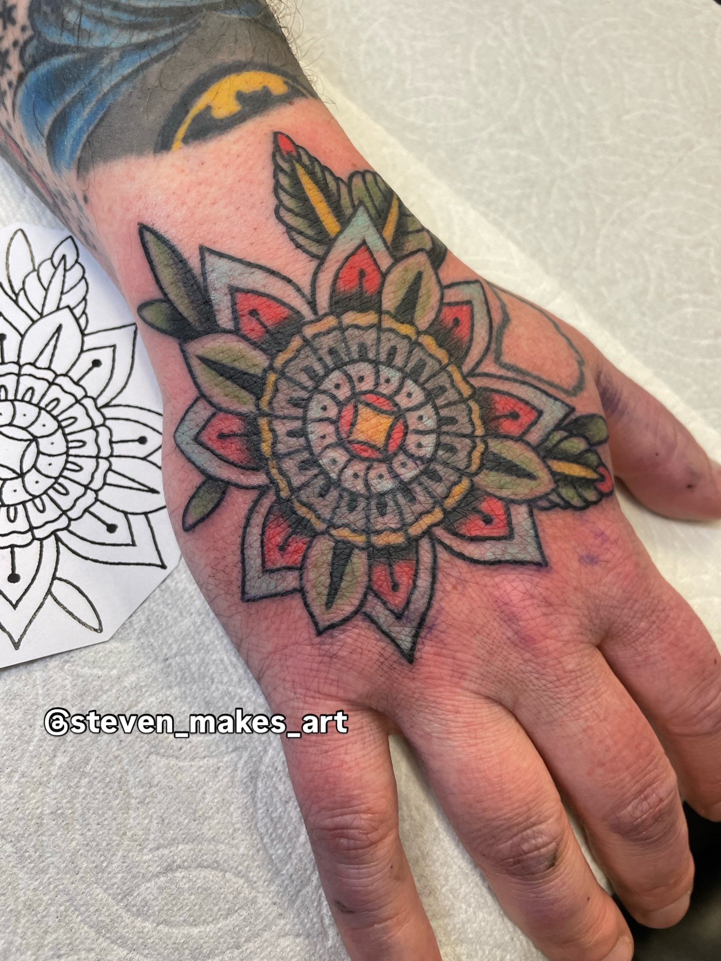 Mandala American traditional tattoo on the hand by Steven Hodges