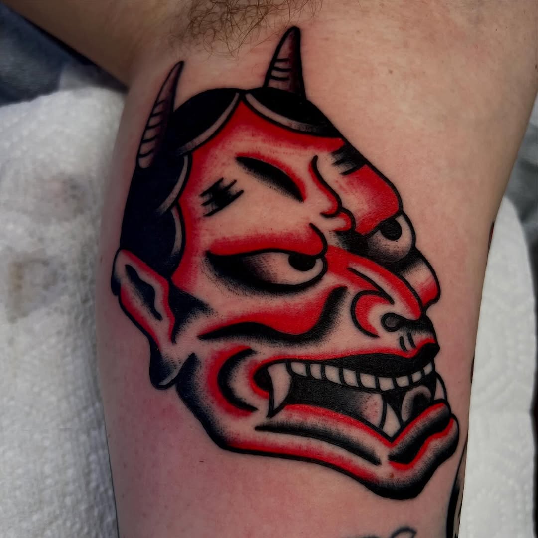 Oni mask neo-traditional tattoo on the forearm by Darren Malekoff