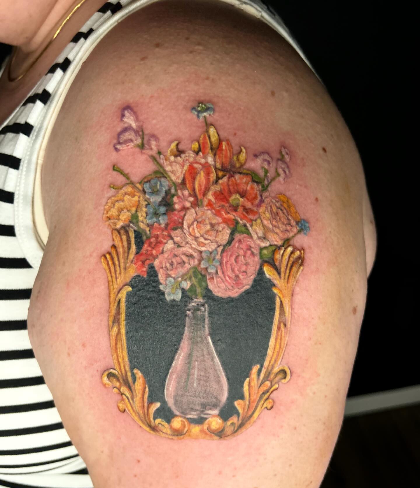 Floral bouquet realism tattoo on the shoulder by Elizabeth (Lib), Murfreesboro, Tennessee