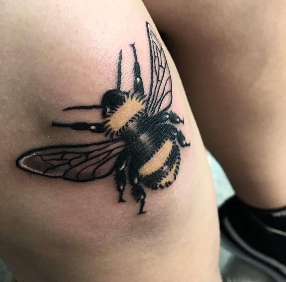 Bumblebee realism tattoo on the thigh by Brandon Harrison, Kansas City, Missouri