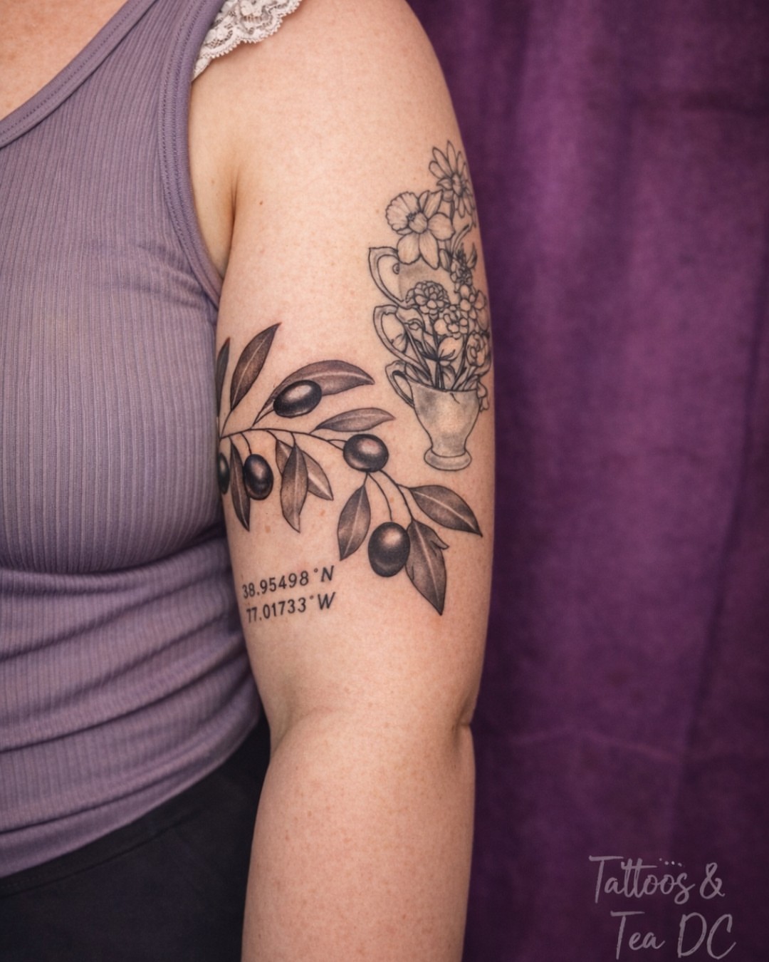 Olive branch and floral arrangement black and grey tattoo on the forearm by Tattoos & Tea DC, Arlington, Virginia