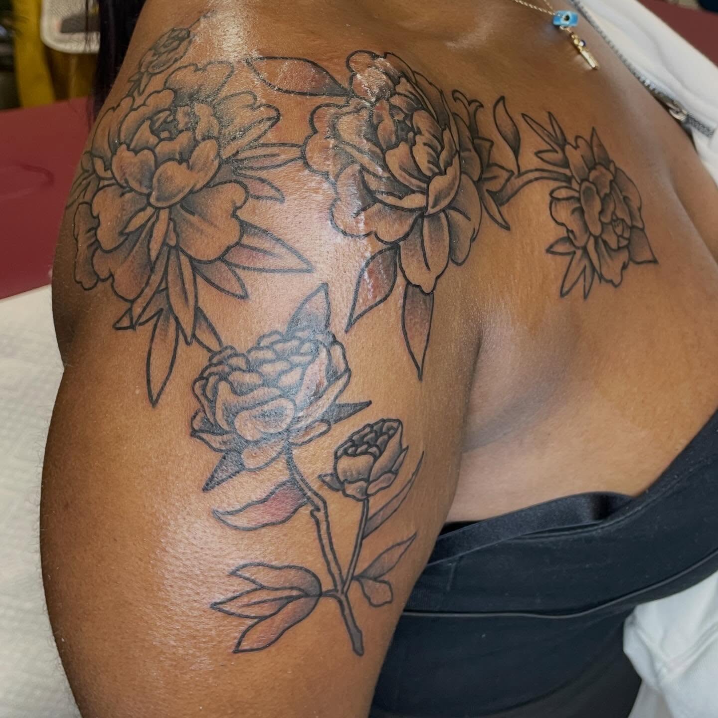 Peony flowers black and grey tattoo on the shoulder by Nicholas M. Passeri