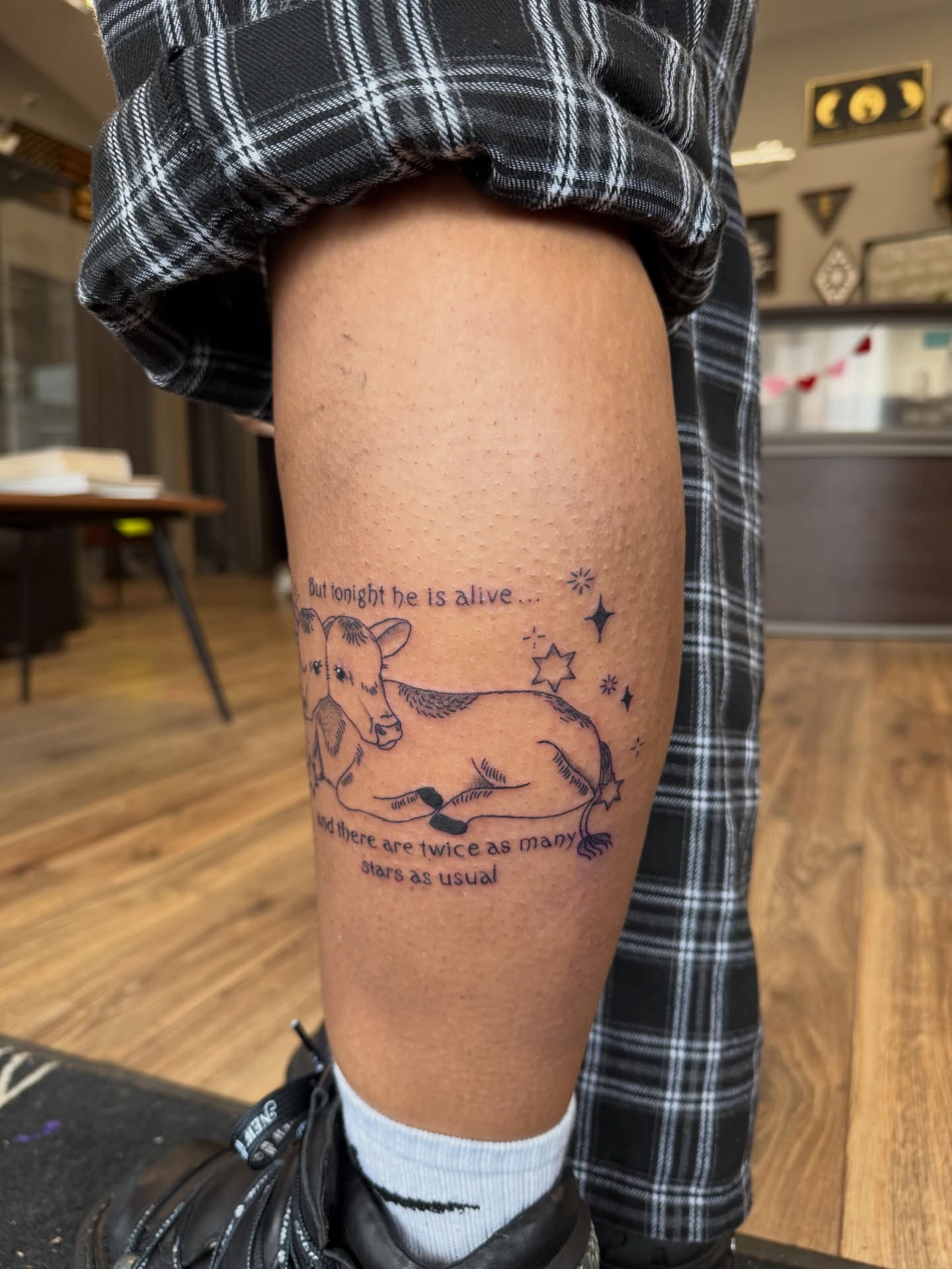 Cow and stars black and grey tattoo on the thigh by Giana Masso