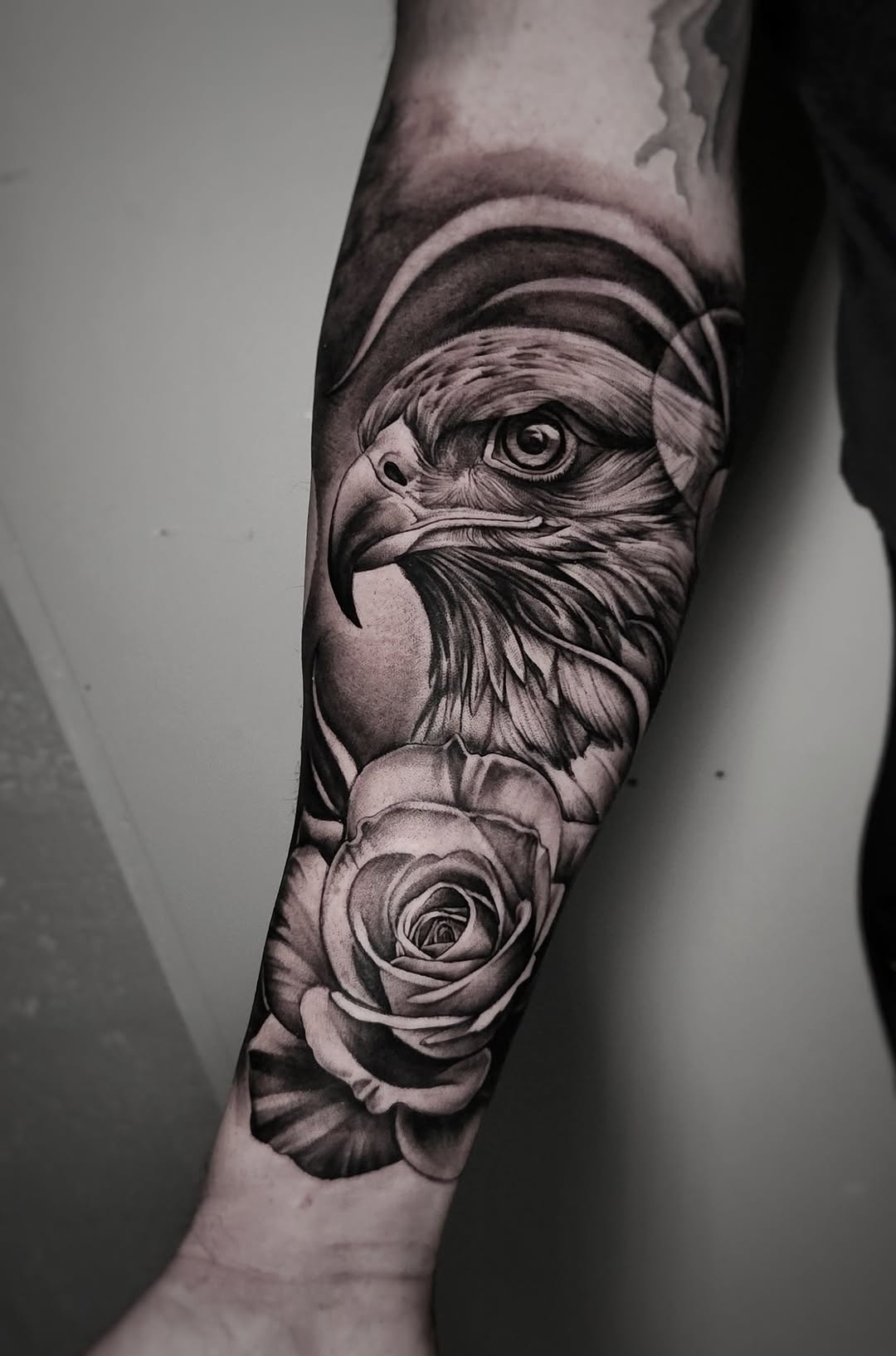 Eagle and rose realism tattoo on the forearm by Elidia Veliz