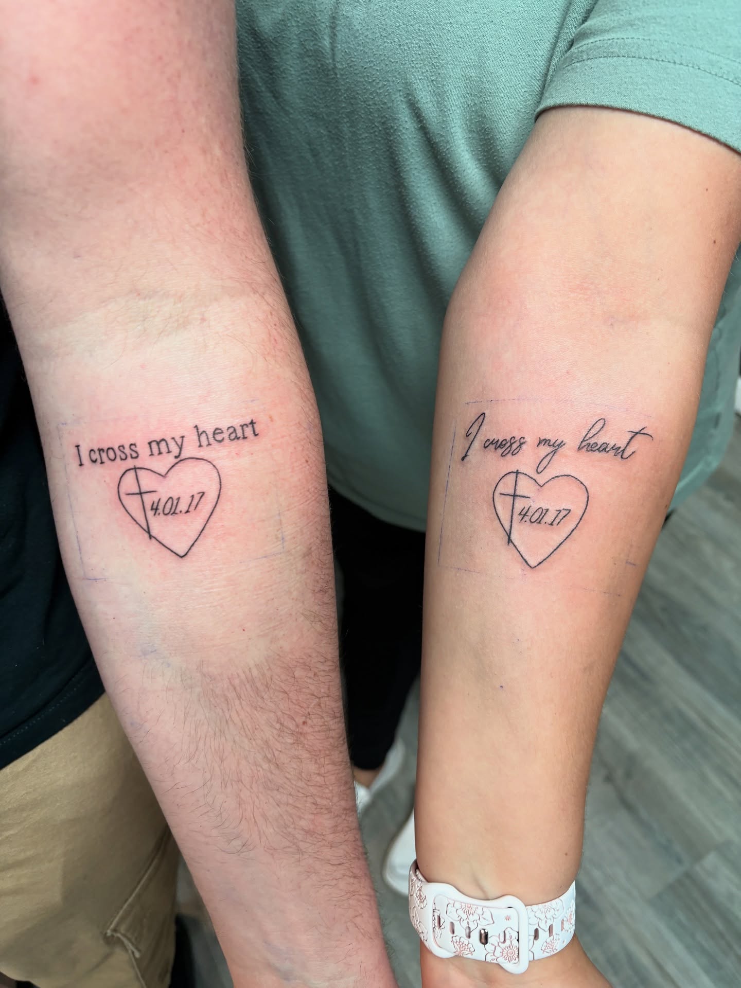 Cross my heart lettering script tattoo on the forearm by Joshua Scott