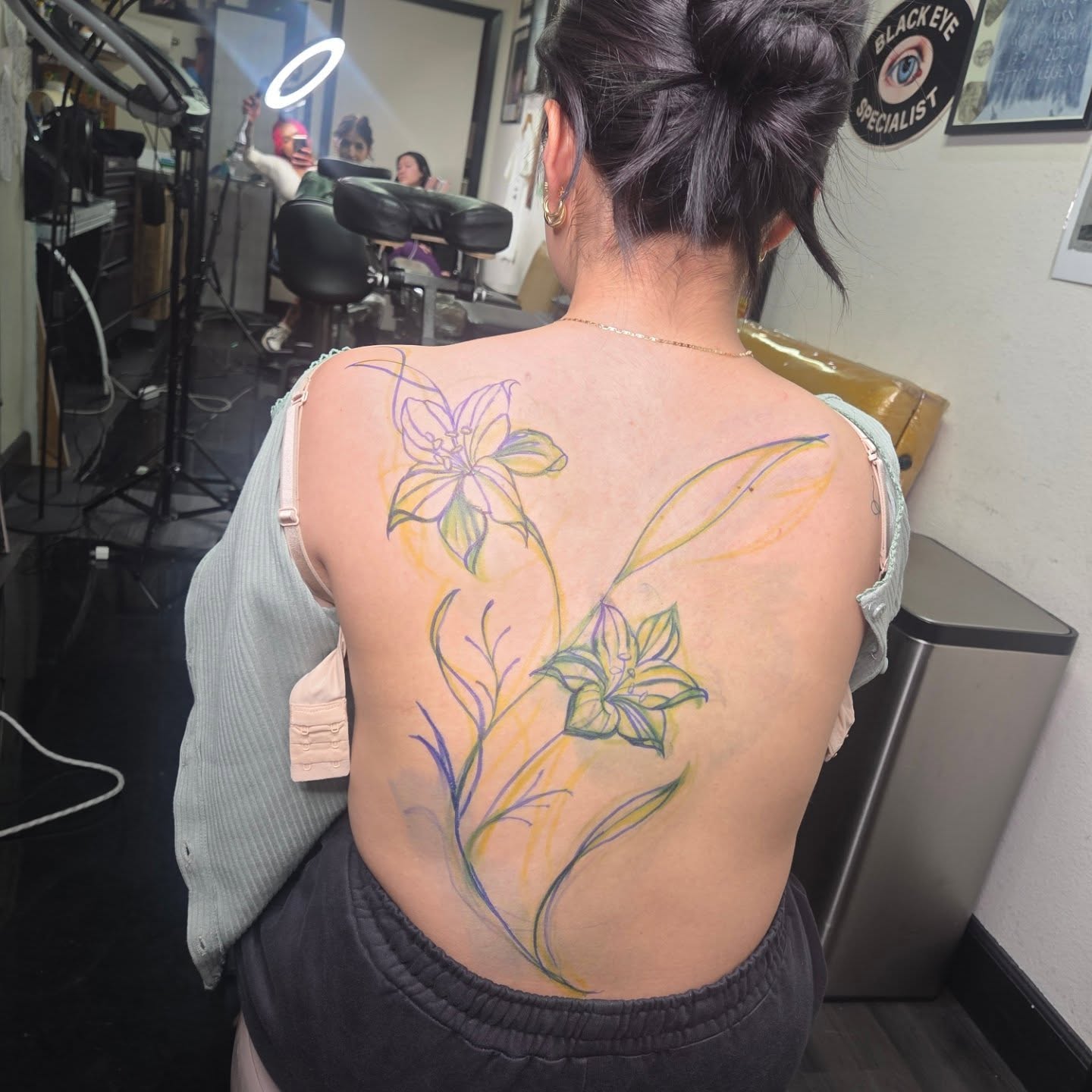 Floral design watercolor tattoo on the back by Yvette Cebreros