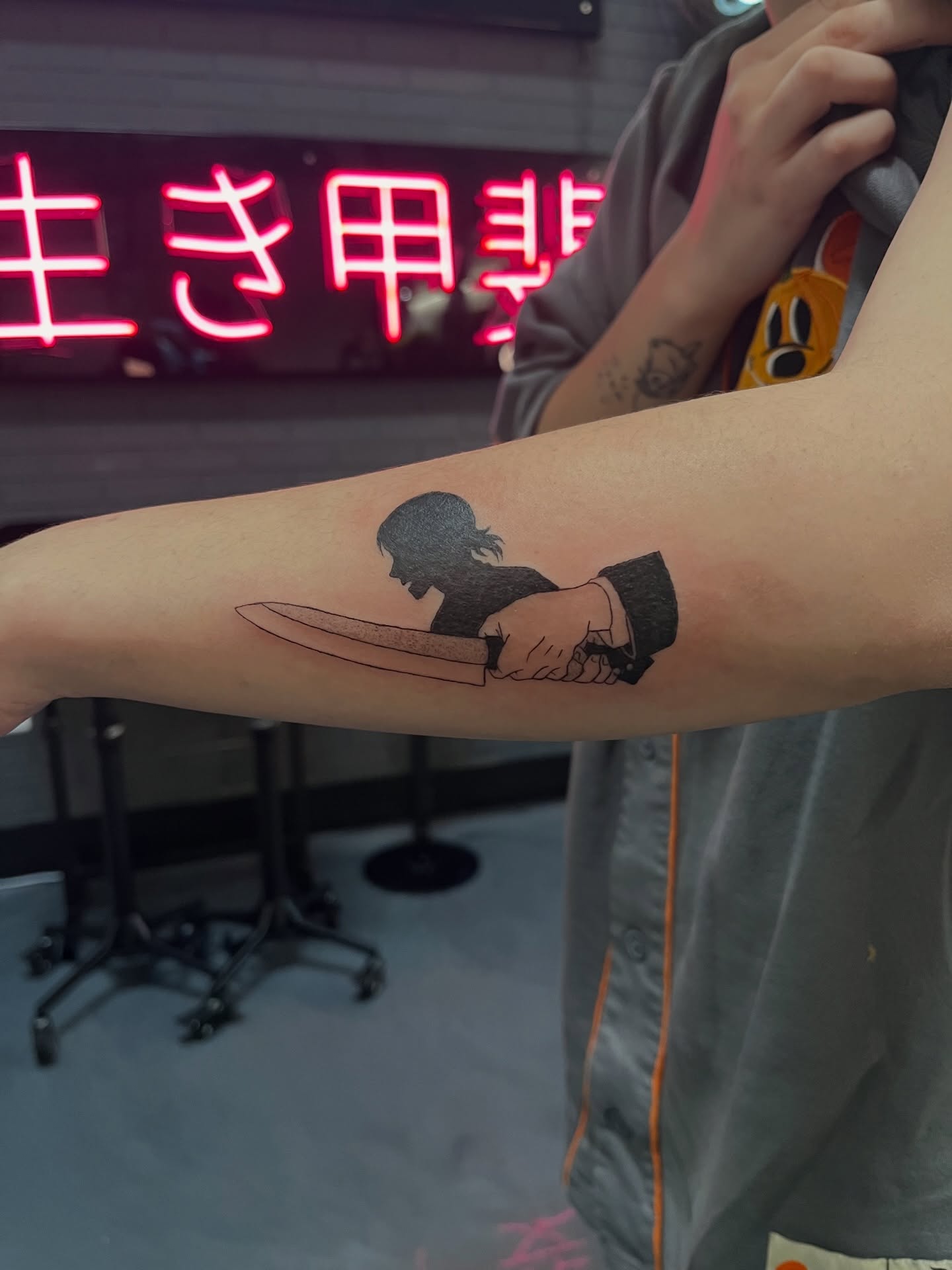 Knife and silhouette black and grey tattoo on the forearm by Bunny 🐰