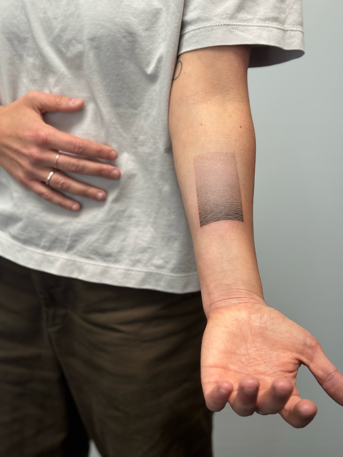 Gradient black and grey tattoo on the forearm by Lea Burkard, Berkeley, California