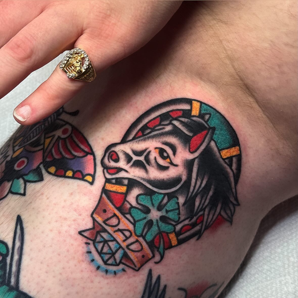 Bull head American traditional tattoo on the forearm by Larry Love