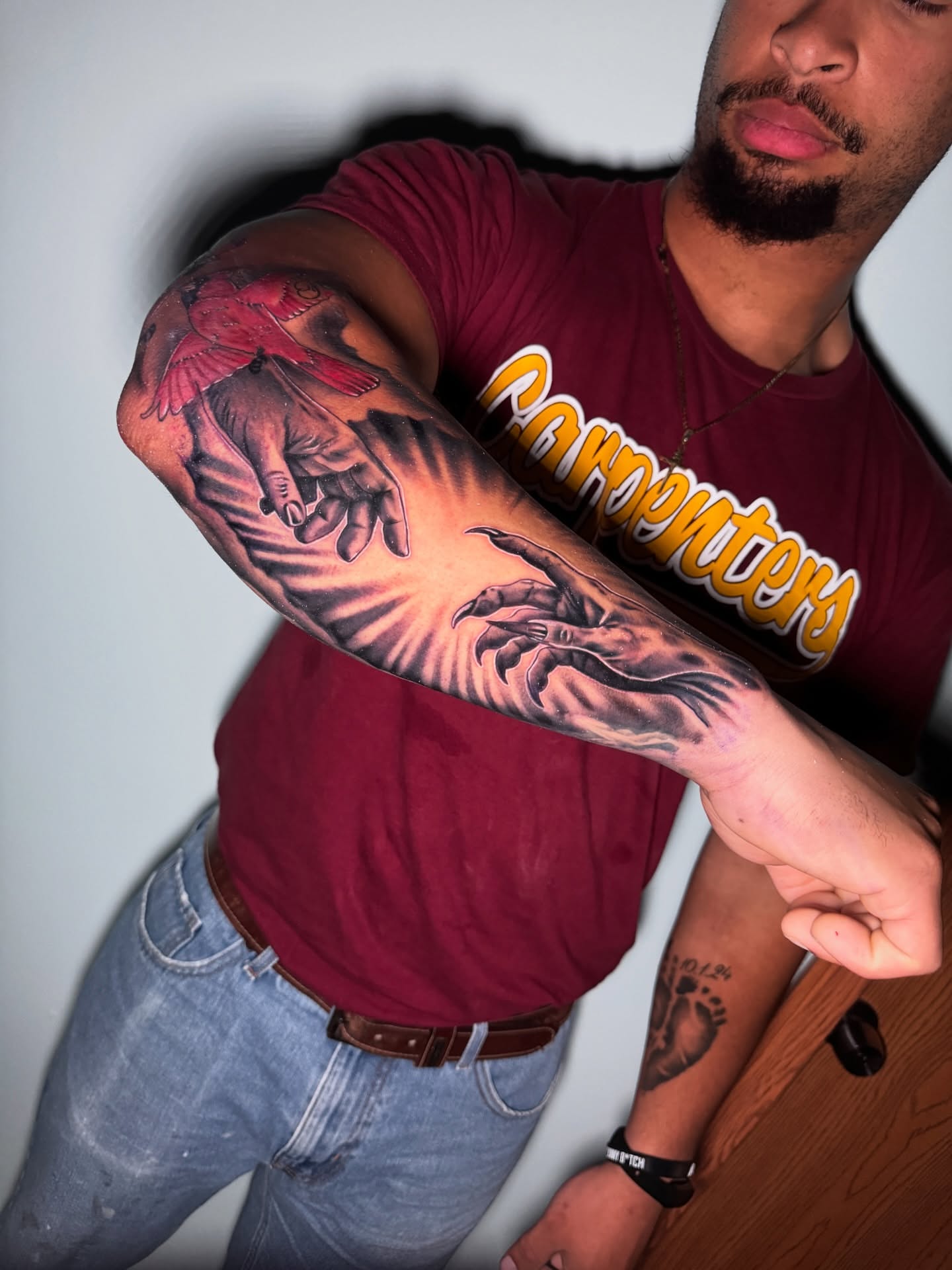 Bird and hand realism tattoo on the forearm by Shane Fowler, Massillon, Ohio
