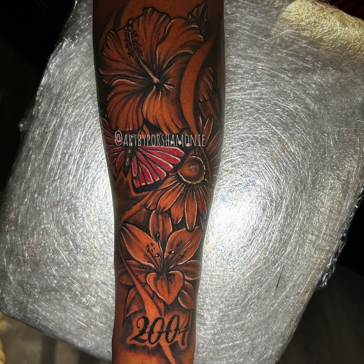 Floral arrangement realism tattoo on the forearm by Porshamonie' THE Tattoo ARTIST