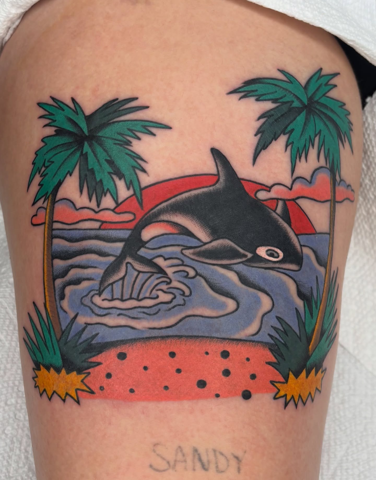 Orca whale American traditional tattoo on the thigh by Charlie Dunkel Tattoo