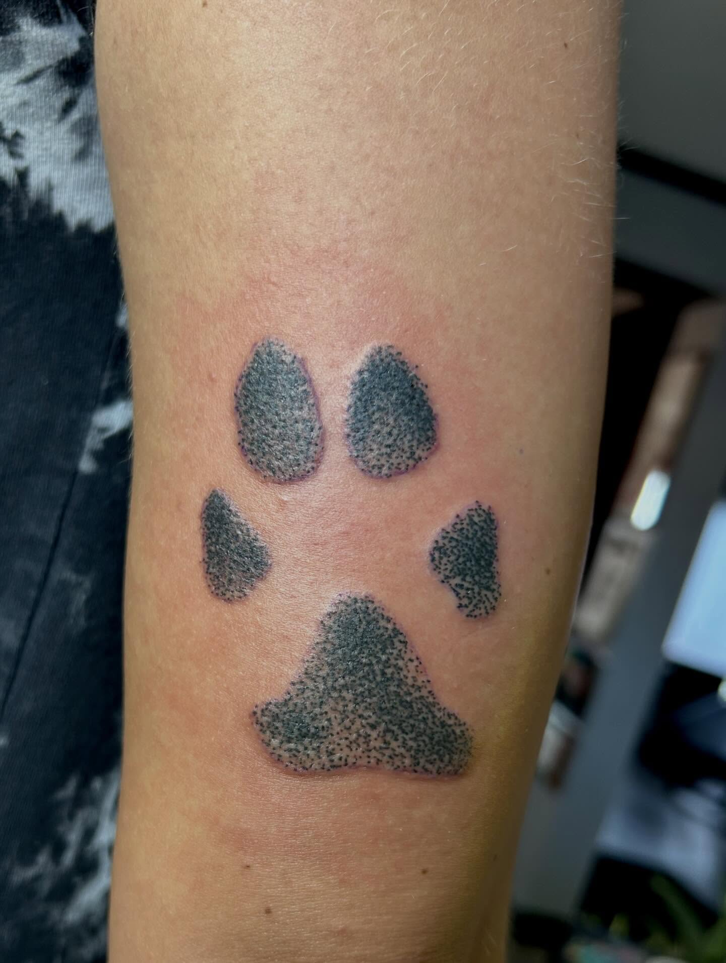 Paw print dotwork tattoo on the forearm by darklord_666