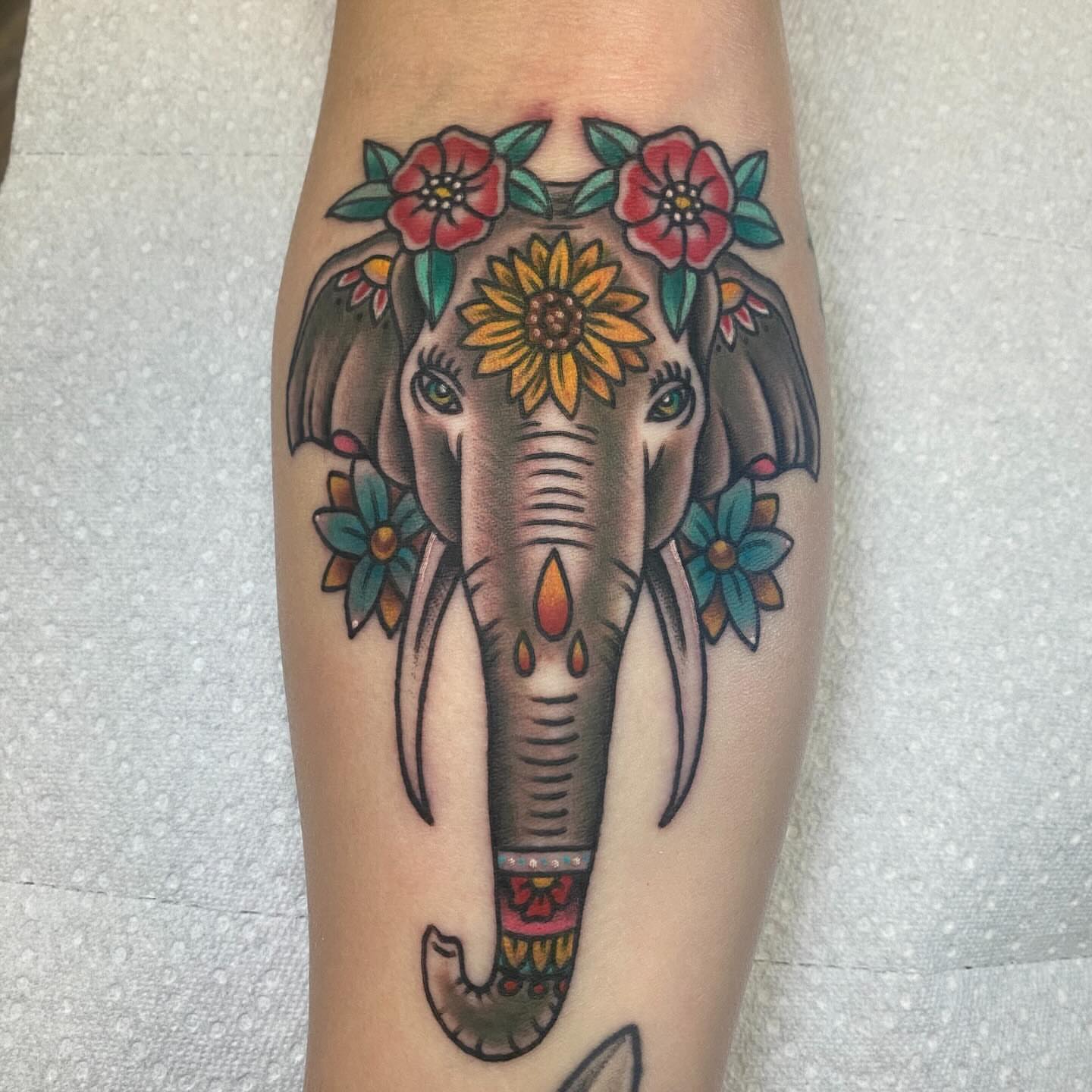 Elephant with floral decorations American traditional tattoo on the forearm by Brandon Heredia, Vacaville, California