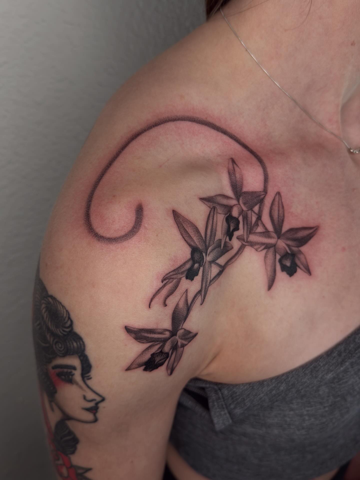 Orchids black and grey tattoo on the shoulder by Nayoung, San Francisco, California