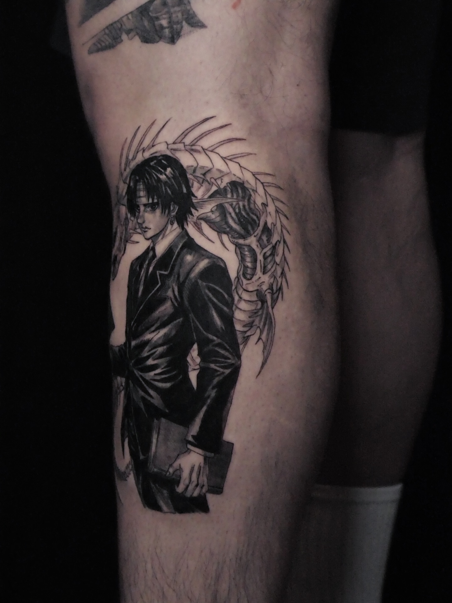 Man with wings realism tattoo on the forearm by Sloppy